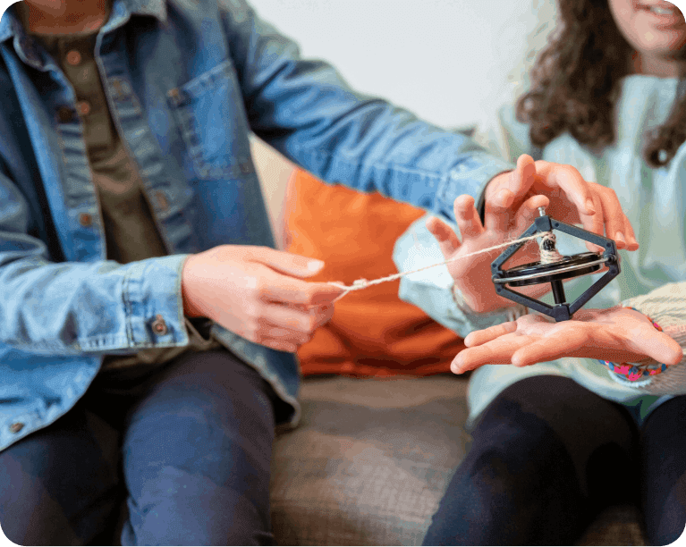 Children playing with spin toy
